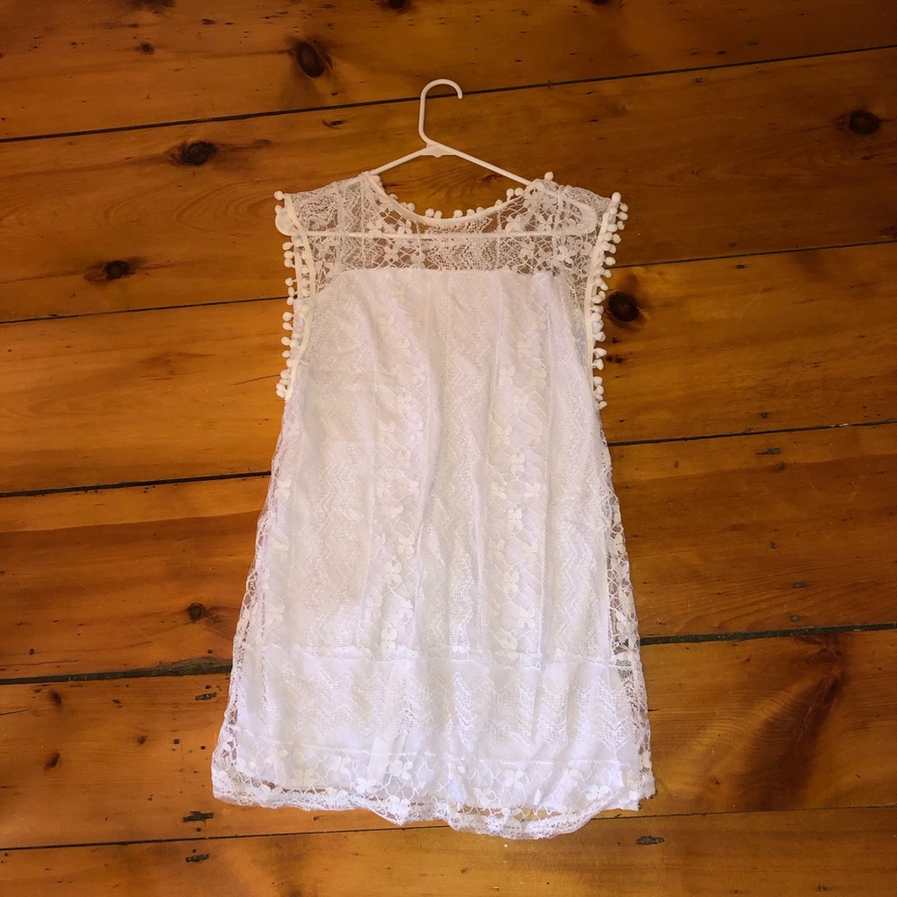 Large lace mini dress in white but fits like a M!
